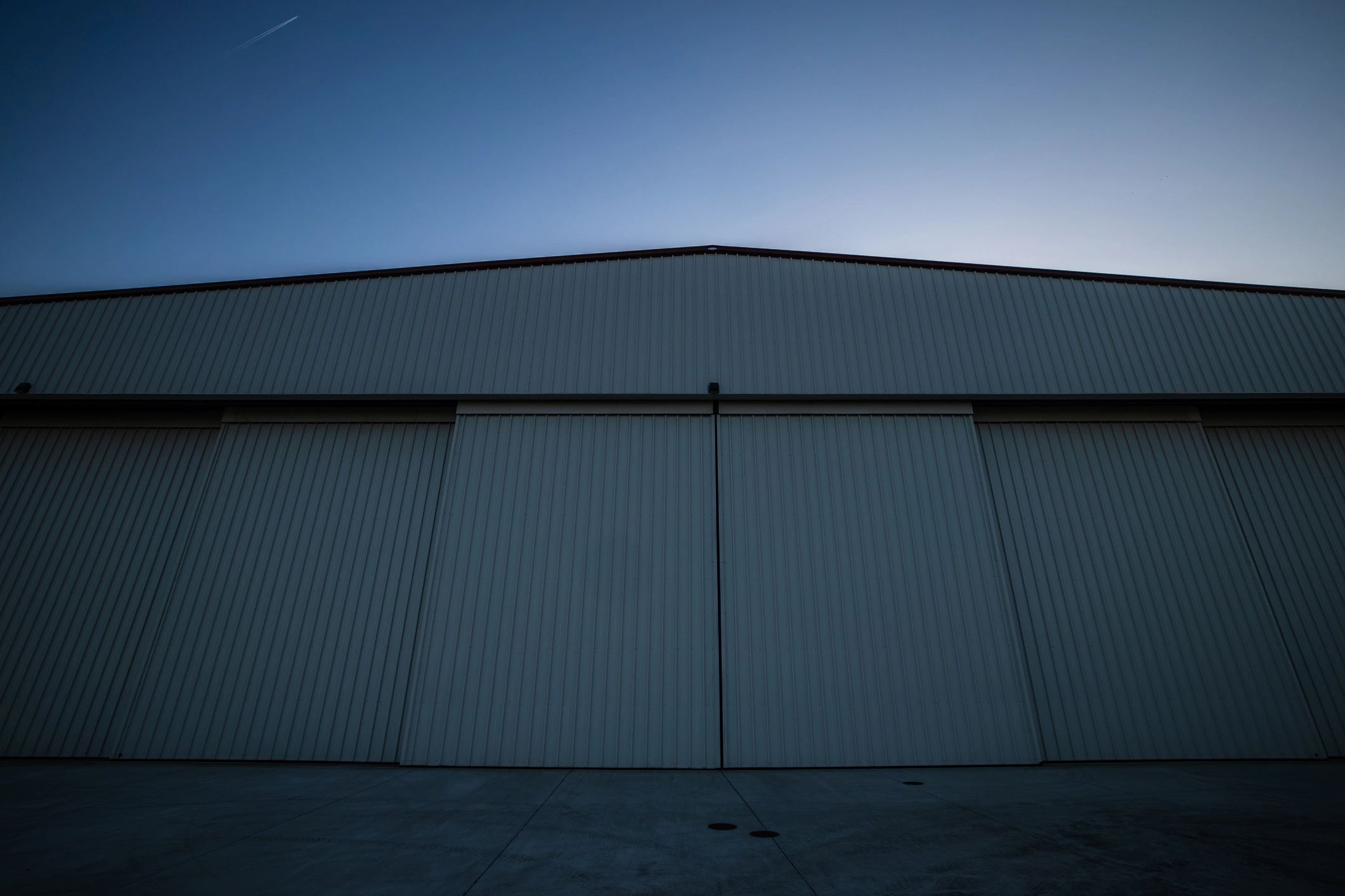 Modern storage facility exterior at sunset